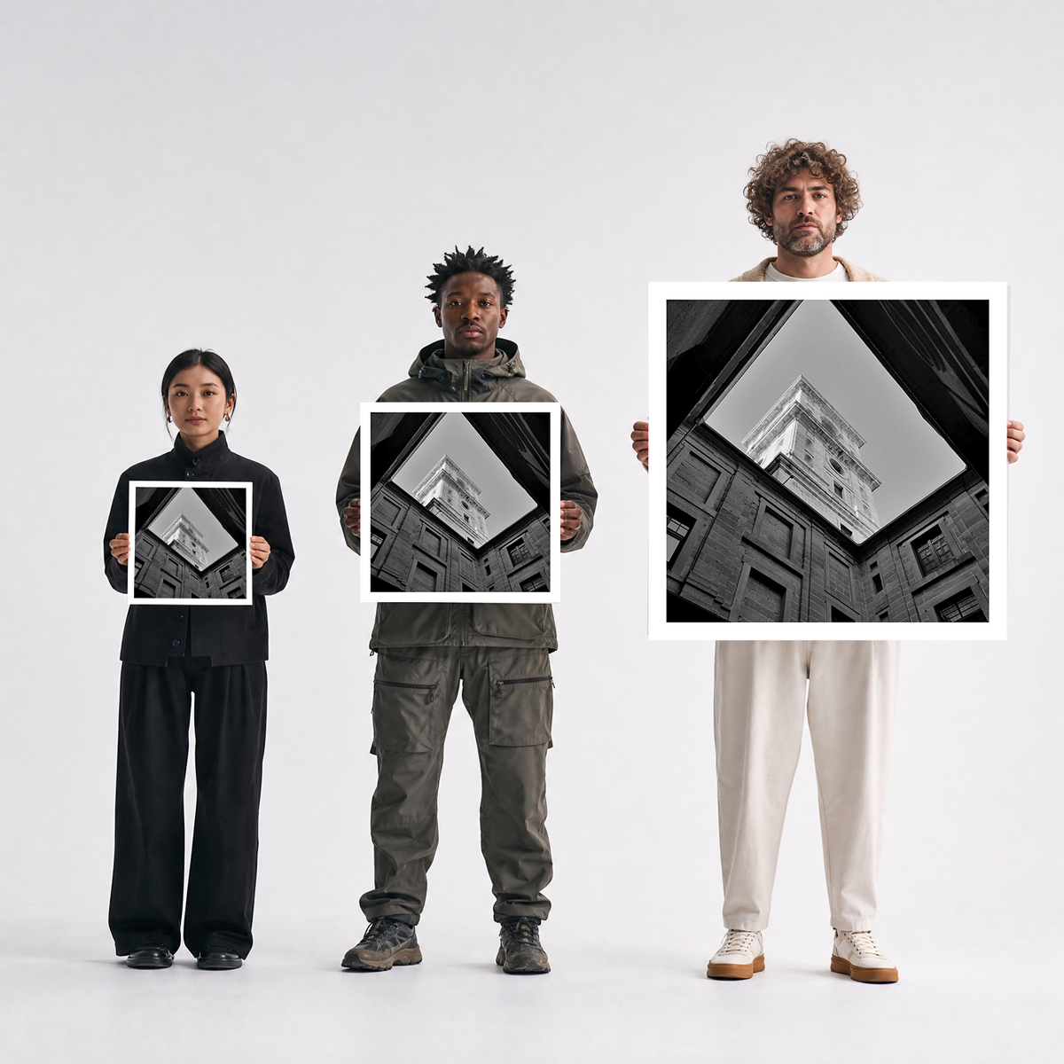 Scale comparison photo showing the 12x12, 20x20, and 40x40 print sizes of 'Courtly' by Sunday Morning, held by three models for size reference.