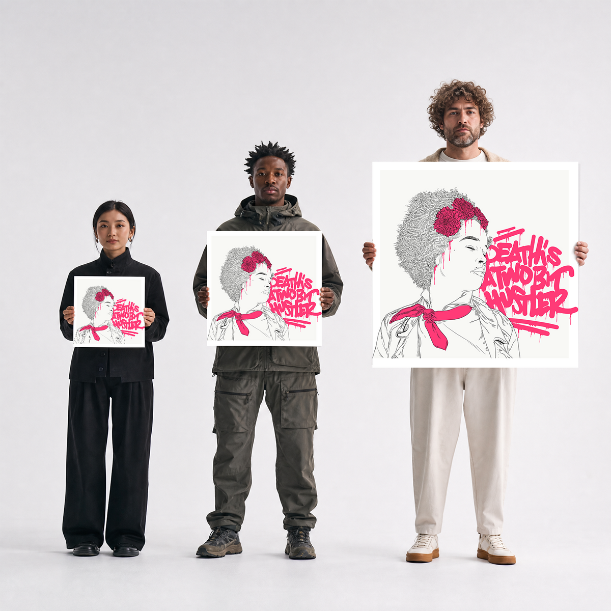 Three people stand against a light gray studio background, each holding a large square art print. The prints show a stylized portrait with gray hair, a red flower, and bold pink text reading 'DEATH IS NOT ANOTHER.