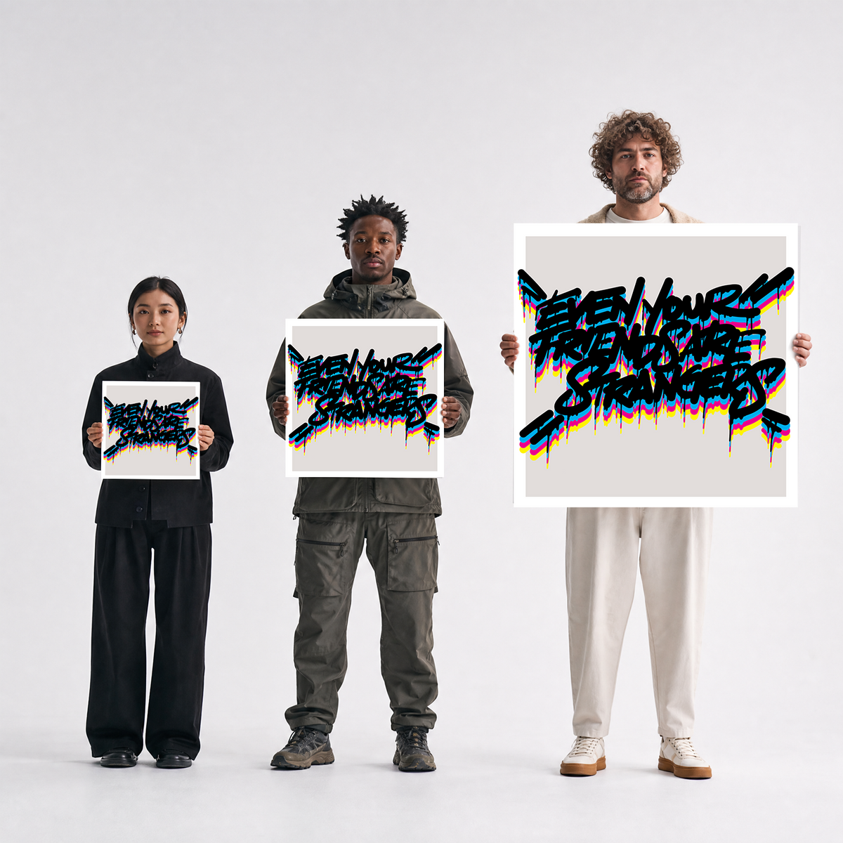 Scale comparison photo showing the 12x12, 20x20, and 40x40 print sizes of 'Even Your Friends Are Strangers' by Sunday Morning, held by three models for size reference.