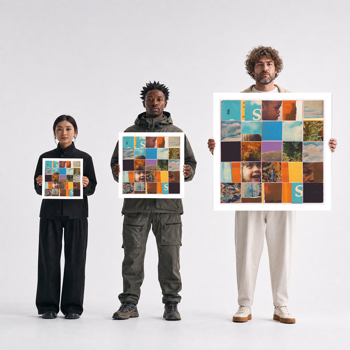 Three people stand against a light gray studio background, each holding a square art print. The prints feature a colorful collage of small images and text, including the word 'STARS'.